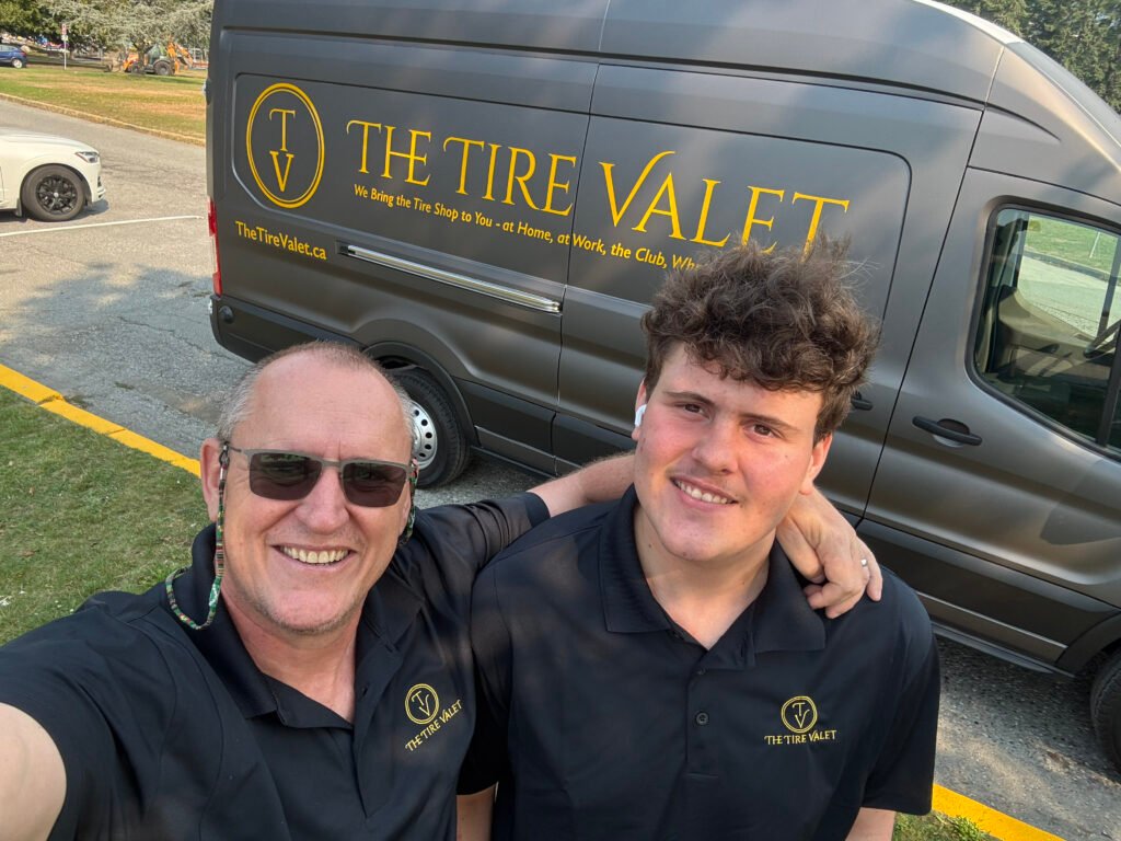 Callie and Connor from The Tire Valet standing in front of their mobile tire service van in West Vancouver