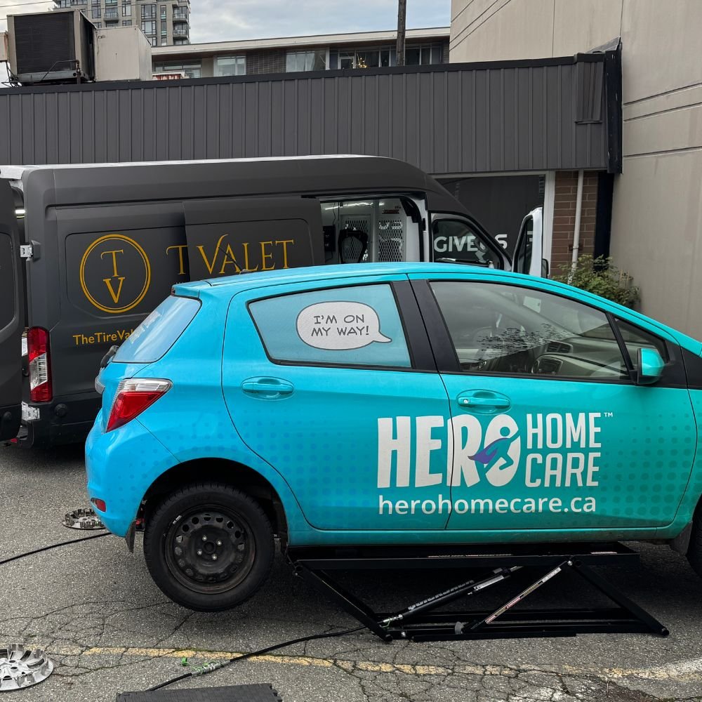 Vehicle raised for a tire rotation by a mobile tire service in North Vancouver